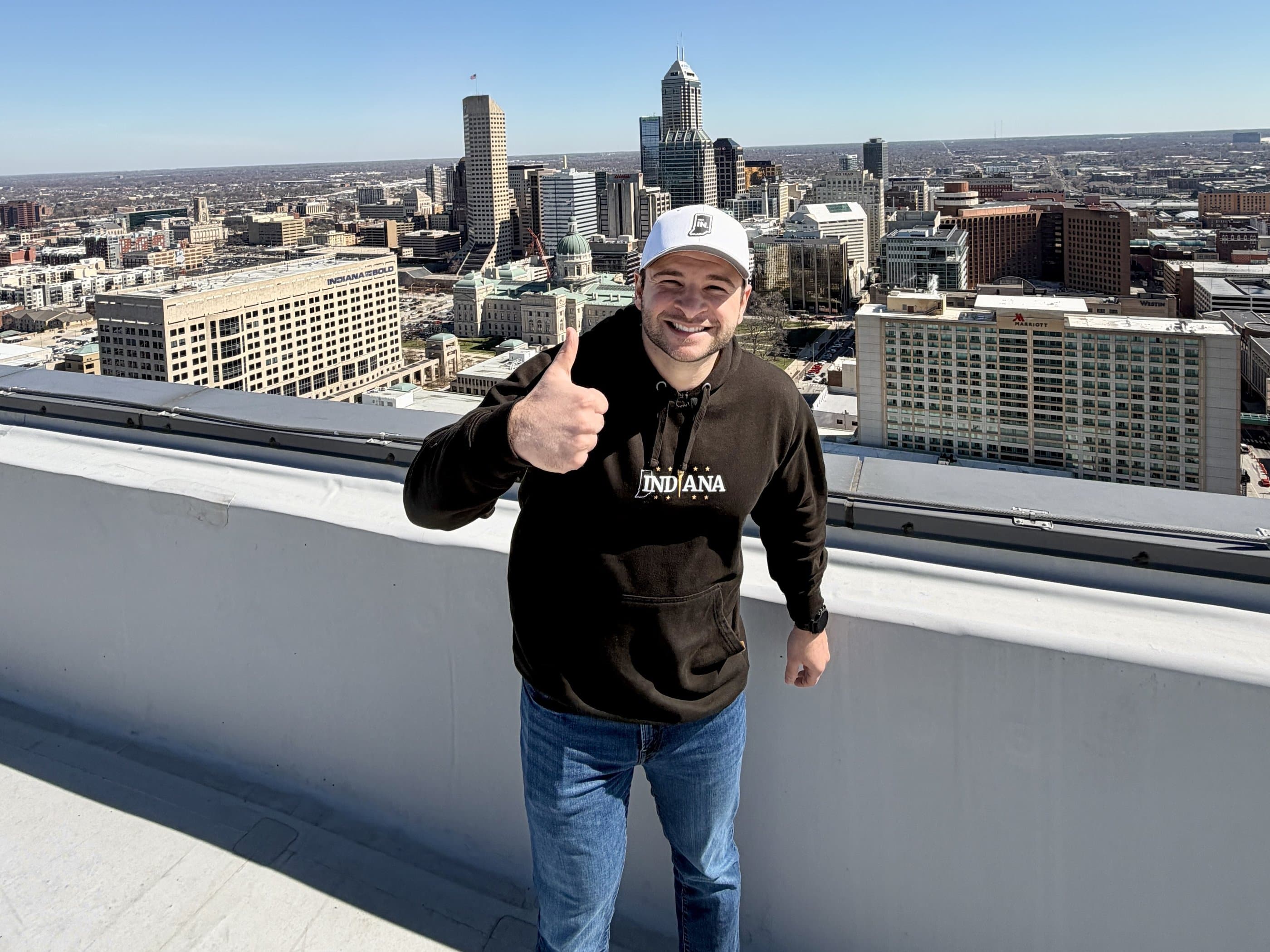 Nate Spangle, founder of Get Indiana, on a rooftop above downtown Indianapolis